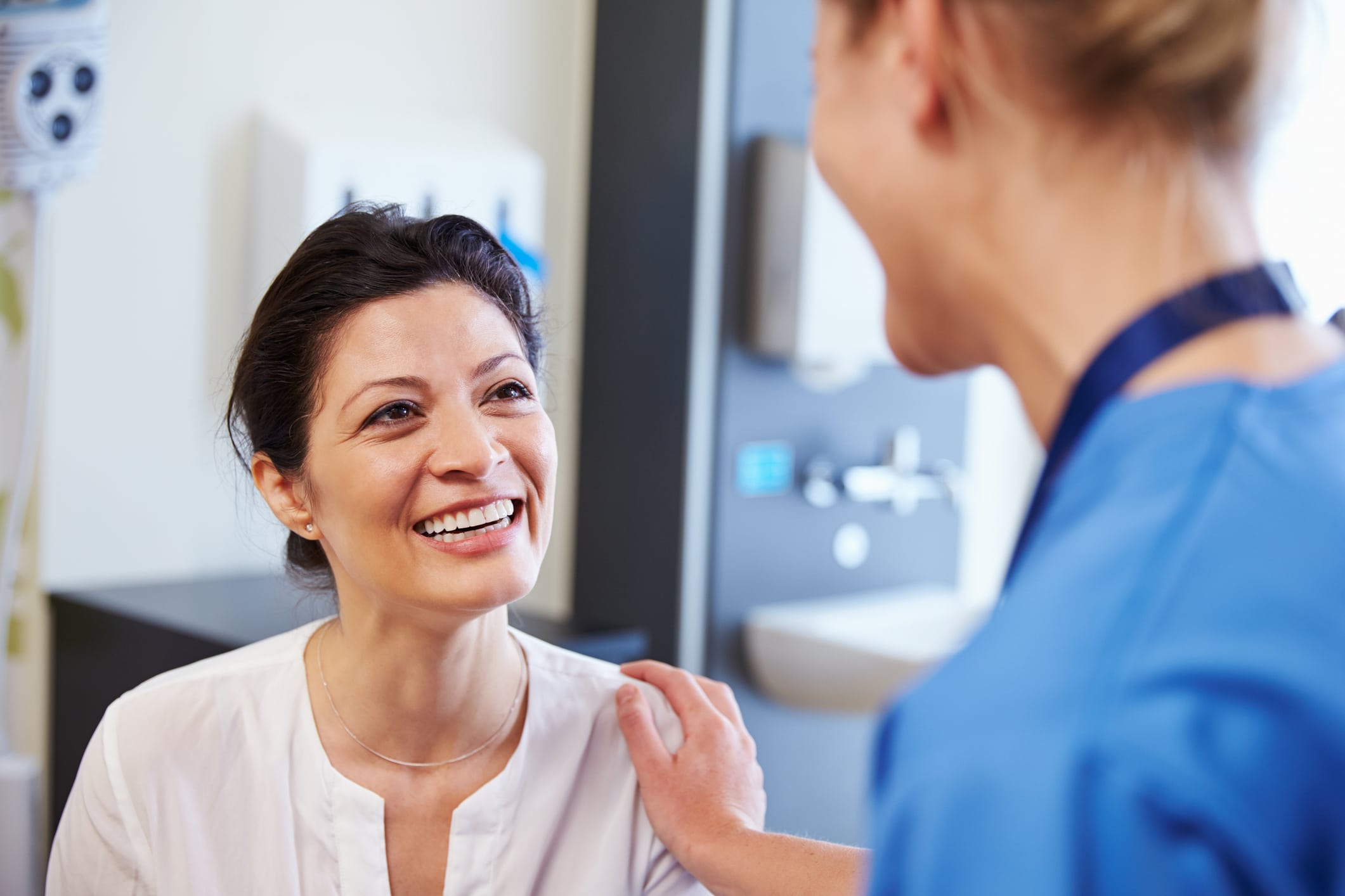 woman smiling at her doctor